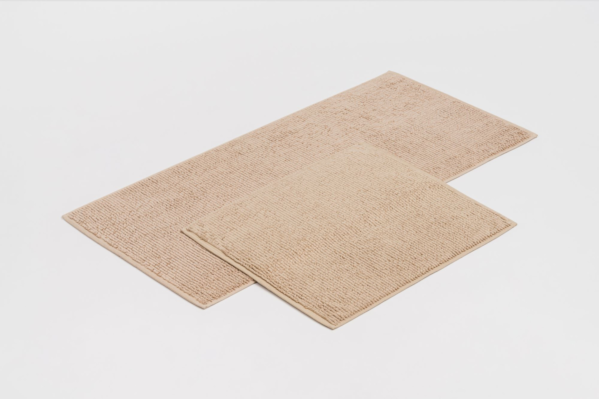 Both our Soft Cotton bath mat sizes are available in four Lejaan signature shades.